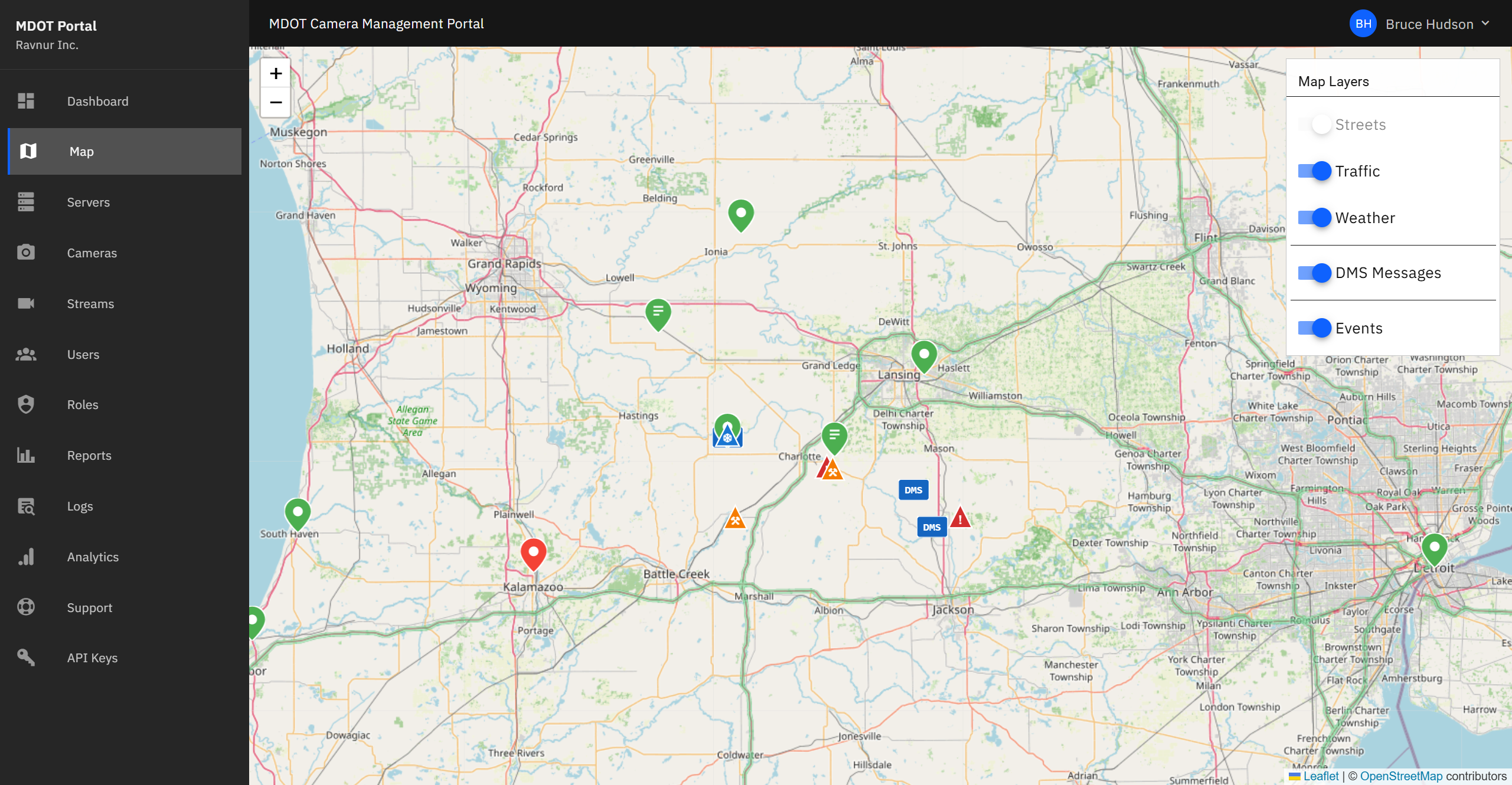 Interactive map of Michigan showing camera locations as colored pins, with map layer controls visible in the corner.